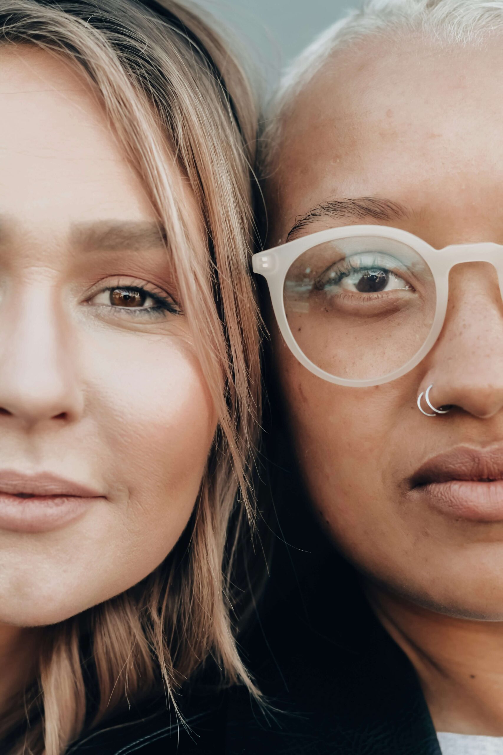 Close-up of two women, symbolizing connection and shared experiences during MitoKhon's retreats and summits.