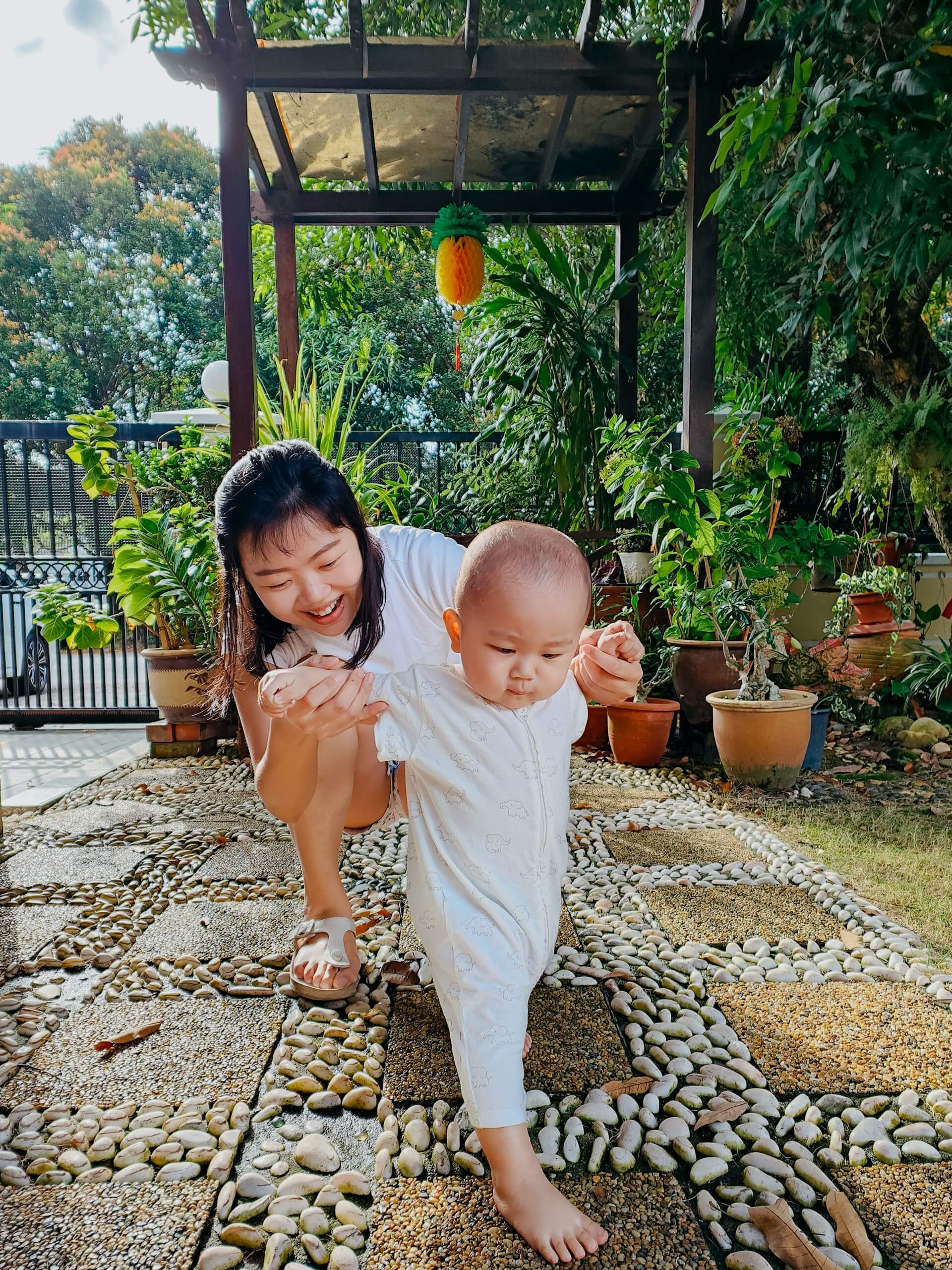 Woman and child bonding in an outdoor setting, symbolizing MitoKhon's commitment to social impact and community health program development.